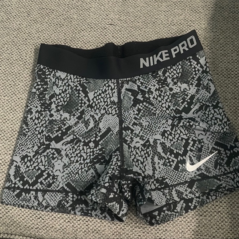 Snake skin Nike pros. Worn a handful of times. Good condition.